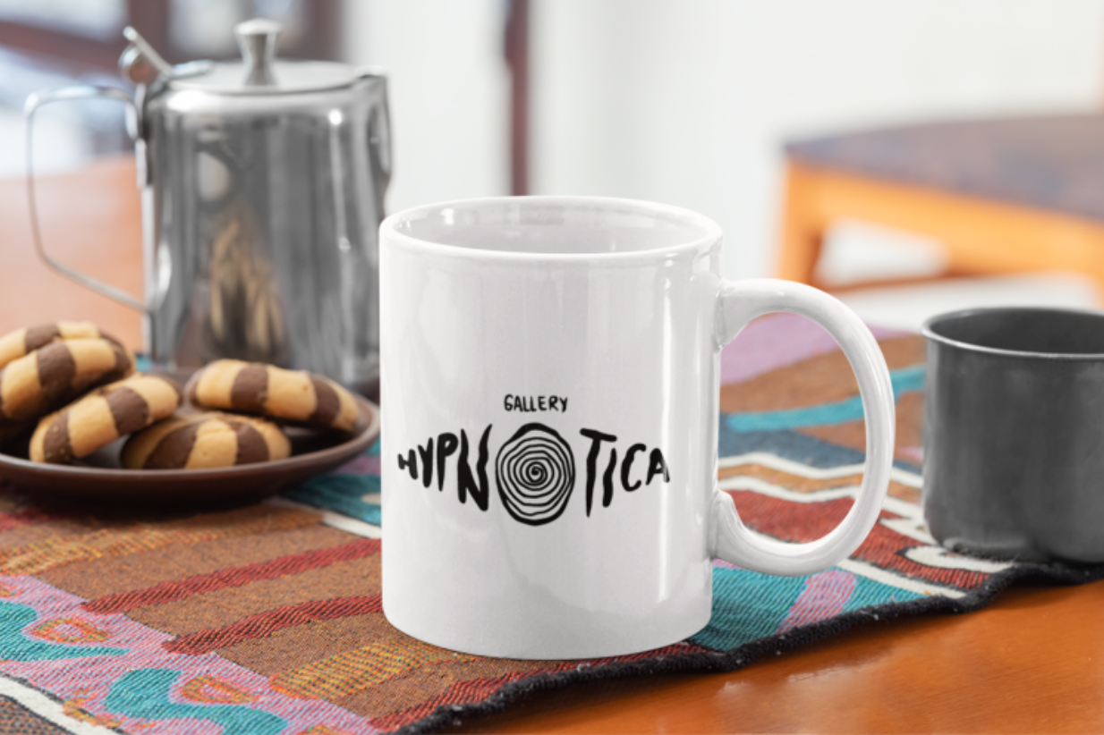 White amazing gallery Hypnotica mug in a table.