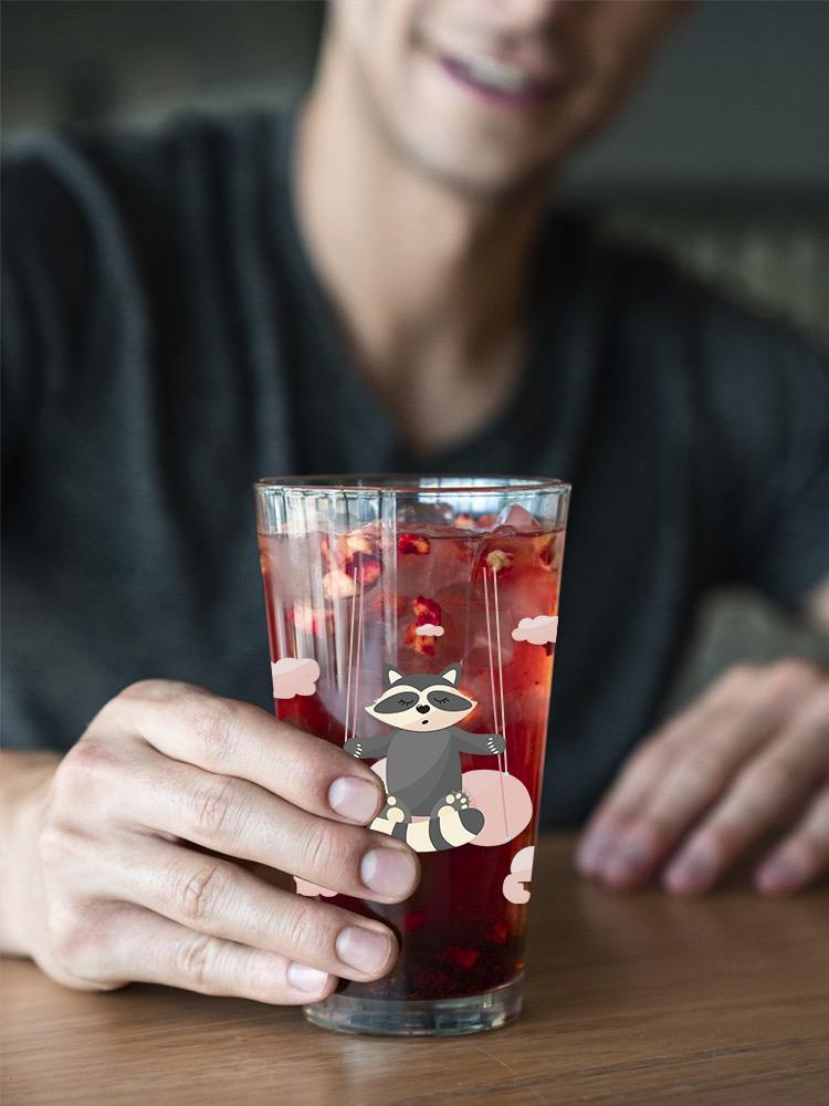 Raccoon On A Swing Pint Glass -Image by Shutterstock