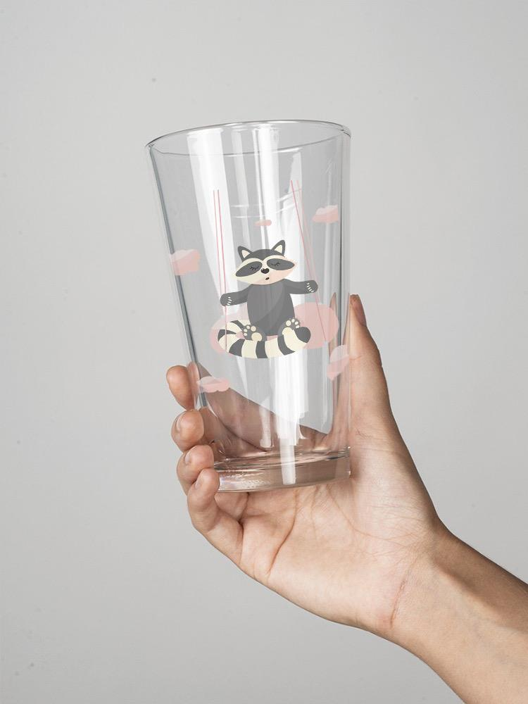 Raccoon On A Swing Pint Glass -Image by Shutterstock