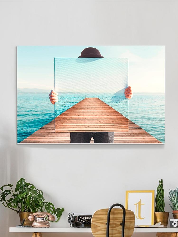 Man Holding A Painting Canvas -Image by Shutterstock