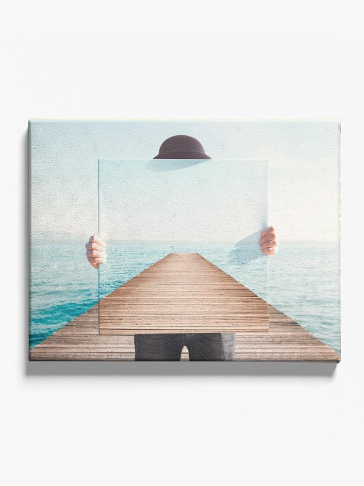 Man Holding A Painting Canvas -Image by Shutterstock